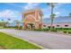 Attractive entrance with decorative archway, colorful accents, and lush landscaping creating a welcoming atmosphere at 11723 Boynton Ln # 1, New Port Richey, FL 34654