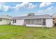 A charming property with an enclosed lanai, metal roof, and a lush lawn, perfect for outdoor enjoyment at 11723 Boynton Ln # 1, New Port Richey, FL 34654