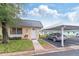 Charming single-story home with a covered carport and well-maintained front lawn at 11723 Boynton Ln # 1, New Port Richey, FL 34654