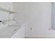 A minimalist laundry room featuring a standard washer and dryer setup at 11723 Boynton Ln # 1, New Port Richey, FL 34654