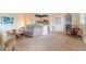Open living space showcases access to the kitchen and dining areas at 11723 Boynton Ln # 1, New Port Richey, FL 34654