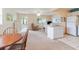 Living room showing access to the kitchen and front door at 11723 Boynton Ln # 1, New Port Richey, FL 34654