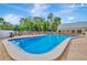 Sparkling community pool featuring ample lounge seating and lush greenery creating a relaxing oasis at 11723 Boynton Ln # 1, New Port Richey, FL 34654