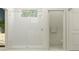 Clean, bright bathroom with a tiled shower and glass door with matching fixtures at 11761 E 74Th Cir, Palmetto, FL 34221