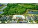 Overhead view of the community pool, clubhouse, parking, and surrounding landscaped homes at 11831 Thicket Wood Dr, Riverview, FL 33579