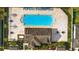 Detailed overhead shot of the community pool, clubhouse, tables, and lounge chairs at 11831 Thicket Wood Dr, Riverview, FL 33579