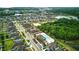 Expansive aerial view showcasing the community's layout, with houses, lakes, and lush greenery at 11831 Thicket Wood Dr, Riverview, FL 33579