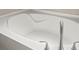 Close-up of a modern bathtub showcasing the sleek design and fixtures at 11831 Thicket Wood Dr, Riverview, FL 33579