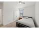 A cozy bedroom is displayed, featuring a ceiling fan and a comfortable bed with a throw pillow at 11831 Thicket Wood Dr, Riverview, FL 33579