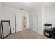 A bright room has two closets with doors and a desk with a chair for a convenient workspace at 11831 Thicket Wood Dr, Riverview, FL 33579