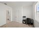 Bedroom has closet with dual doors and a desk with a chair for a convenient workspace at 11831 Thicket Wood Dr, Riverview, FL 33579