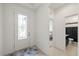 Bright foyer features a decorative glass front door with views into an adjacent bedroom and bathroom at 11831 Thicket Wood Dr, Riverview, FL 33579