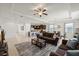 Open-concept living space showcasing kitchen, dining, and living areas with abundant natural light at 11831 Thicket Wood Dr, Riverview, FL 33579