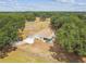 Aerial view of a beautiful home on a large lot surrounded by mature trees and a spacious backyard, creating a private oasis at 1202 Williams Rd, Plant City, FL 33565