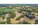 Picturesque aerial view of a serene property featuring mature trees and manicured lawns at 1202 Williams Rd, Plant City, FL 33565