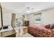 Bright bedroom featuring a ceiling fan, wood floors, and access to a private outdoor space at 1202 Williams Rd, Plant City, FL 33565