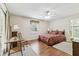 Cozy bedroom featuring wood floors and ample natural light at 1202 Williams Rd, Plant City, FL 33565