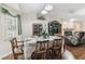 Inviting dining area featuring wood floors, a fireplace, and elegant decor at 1202 Williams Rd, Plant City, FL 33565