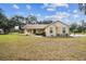 Charming single-story home with a well-maintained lawn and inviting curb appeal on a sunny day at 1202 Williams Rd, Plant City, FL 33565