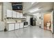 This spacious garage features a functional kitchenette area and a convenient half bathroom at 1202 Williams Rd, Plant City, FL 33565