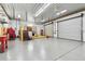 This garage features multiple bays with roll up doors and ample storage space at 1202 Williams Rd, Plant City, FL 33565
