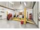 Well-equipped garage with a car lift, tools, and ample space for automotive maintenance and projects at 1202 Williams Rd, Plant City, FL 33565