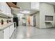 This spacious garage features a functional kitchenette area and a convenient half bathroom at 1202 Williams Rd, Plant City, FL 33565