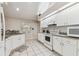 Bright kitchen with granite countertops, white cabinetry, and ample counter space at 1202 Williams Rd, Plant City, FL 33565