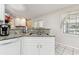 Kitchen features granite countertops, white cabinets, and stainless steel sink at 1202 Williams Rd, Plant City, FL 33565