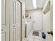 Practical laundry room featuring ample storage and tiled flooring at 1202 Williams Rd, Plant City, FL 33565