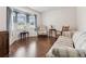 Cozy living room featuring hardwood floors, a bay window, and comfortable seating at 1202 Williams Rd, Plant City, FL 33565