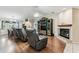 A spacious living room features a fireplace and vaulted ceilings, providing a welcoming atmosphere at 1202 Williams Rd, Plant City, FL 33565