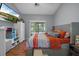 Comfortable bedroom with sliding glass doors and a cozy bed at 12493 Fish Cove Dr, Spring Hill, FL 34609