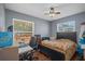 Bedroom includes a bed and a desk area, bathed in natural light at 12493 Fish Cove Dr, Spring Hill, FL 34609