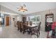 Elegant dining room featuring a large window, classic furniture, and a built-in bar for entertaining at 12493 Fish Cove Dr, Spring Hill, FL 34609