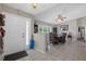 Inviting tiled foyer featuring a view of the dining area and living room, illuminated by natural light at 12493 Fish Cove Dr, Spring Hill, FL 34609