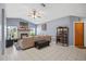 Spacious living room with vaulted ceilings, fireplace, ample natural light, and stylish decor at 12493 Fish Cove Dr, Spring Hill, FL 34609