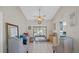 Bright, airy living area with neutral walls, tiled floors, ceiling fan, and access to the outdoors at 12493 Fish Cove Dr, Spring Hill, FL 34609