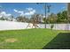 Spacious backyard featuring a play set, providing a safe and fun outdoor space for  at 12606 Rain Forest St, Temple Terrace, FL 33617