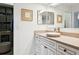 Bright bathroom with a vessel sink, framed mirrors, decorative accents, and a convenient storage closet at 12606 Rain Forest St, Temple Terrace, FL 33617