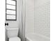 Well-maintained bathroom featuring modern fixtures, white subway tile shower, and updated toilet at 12606 Rain Forest St, Temple Terrace, FL 33617
