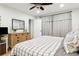 Comfortable bedroom with a ceiling fan, modern dresser, and stylish curtains providing a relaxing retreat at 12606 Rain Forest St, Temple Terrace, FL 33617