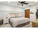 Large bedroom with neutral tones, a decorative headboard, and a spacious closet at 12606 Rain Forest St, Temple Terrace, FL 33617