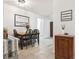 Charming dining area with a wooden table set for four and a welcoming message board at 12606 Rain Forest St, Temple Terrace, FL 33617