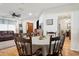 Comfortable dining area adjacent to the living room with hardwood floors at 12606 Rain Forest St, Temple Terrace, FL 33617