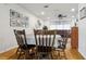 Open dining room with hardwood floors connected to the living room at 12606 Rain Forest St, Temple Terrace, FL 33617