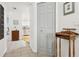 Hallway with tiled floors leading to the kitchen at 12606 Rain Forest St, Temple Terrace, FL 33617