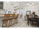 Bright kitchen featuring a breakfast bar, stainless steel appliances, and open layout to the dining area at 12606 Rain Forest St, Temple Terrace, FL 33617