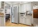 Modern kitchen with stainless steel refrigerator and built-in microwave at 12606 Rain Forest St, Temple Terrace, FL 33617