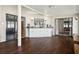 Bright living area with white cabinets and countertops, recessed lights, and dark wood flooring at 12606 Rain Forest St, Temple Terrace, FL 33617